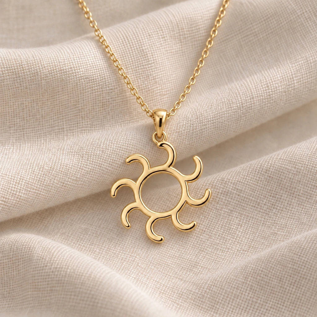 Gold Alchemy Sun Symbol pendant necklace in an 18k gold plated finish