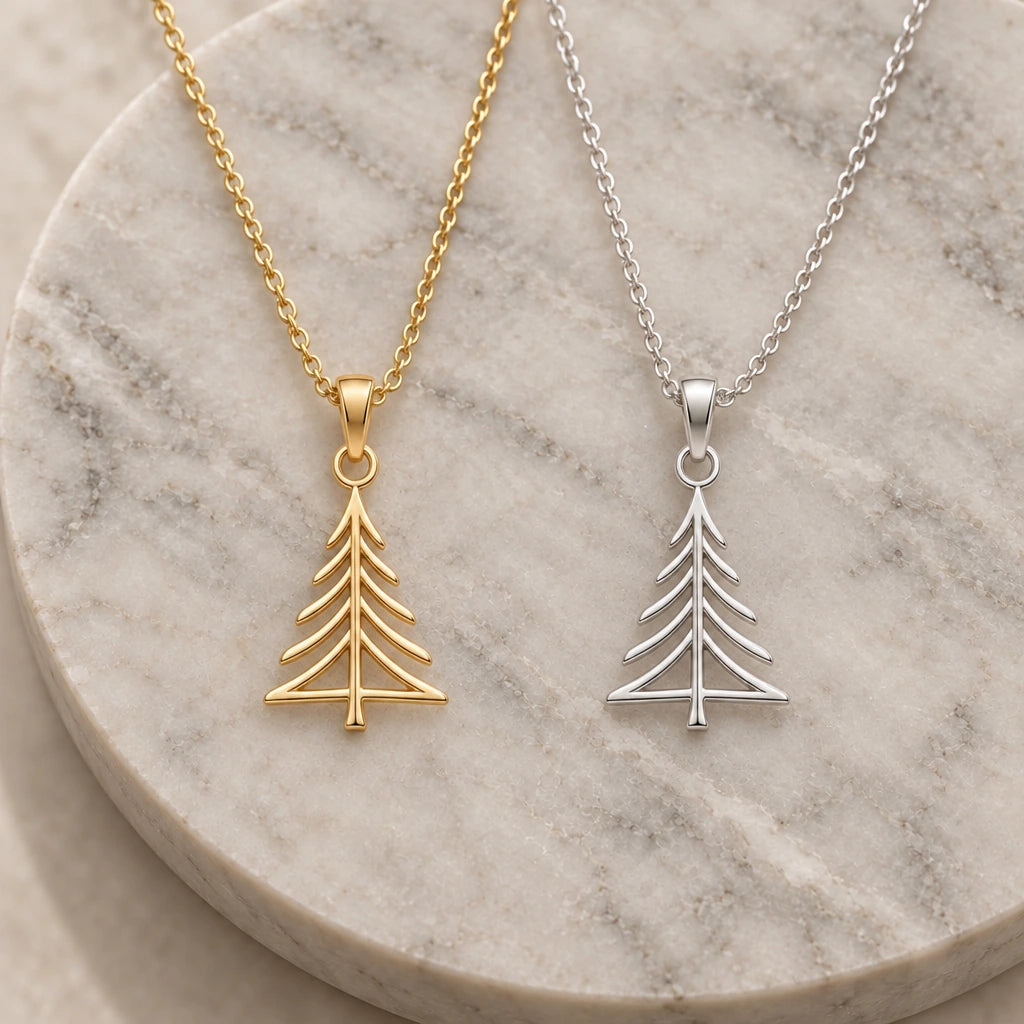 Pine Crest Outline Tree pendant necklace in silver and gold finishes side by side