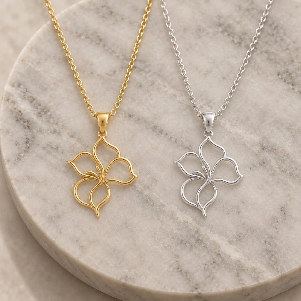 Velvet Petal Flower Outline pendant necklace in silver and gold finishes side by side