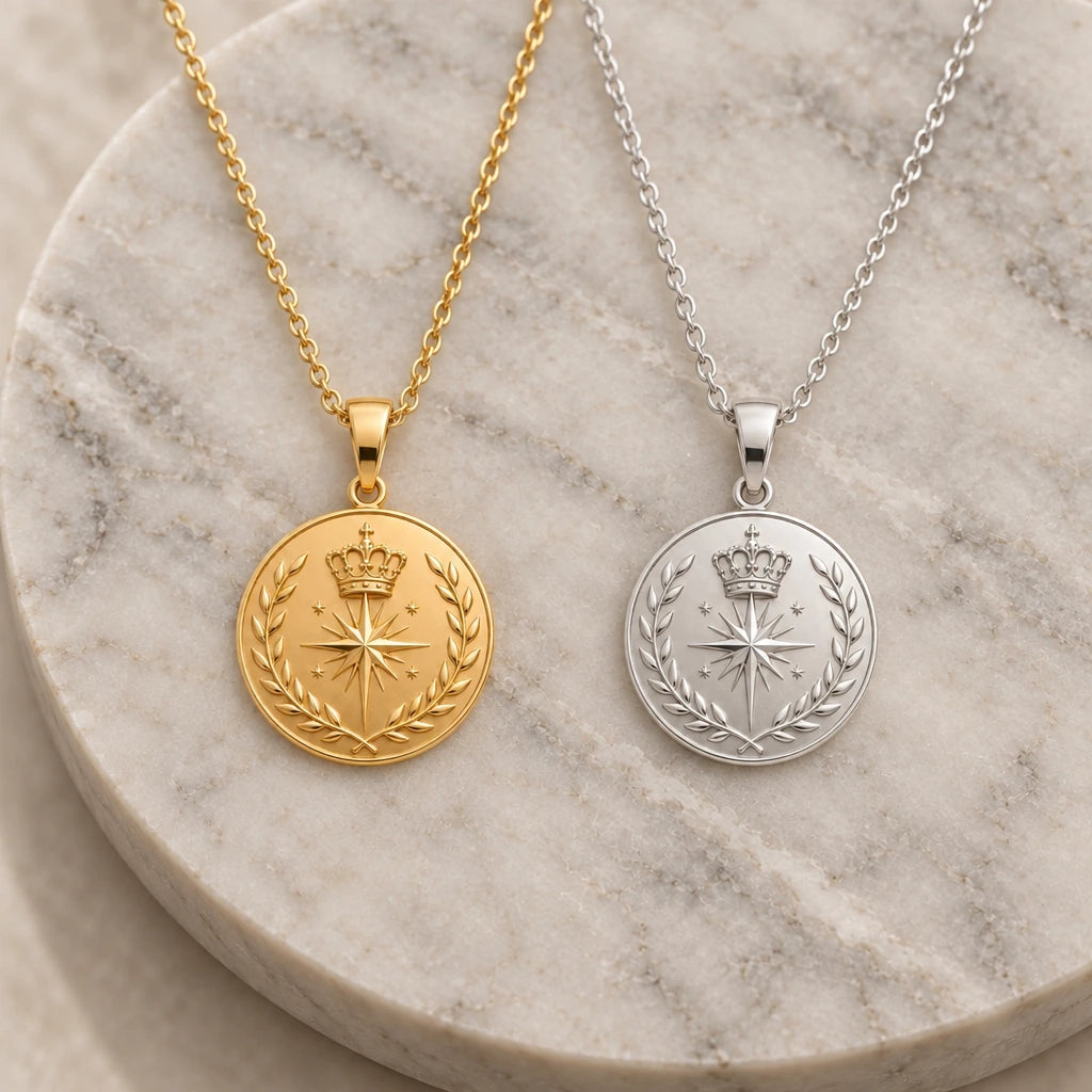 Crowned Compass Relic Disc pendant necklace in silver and gold finishes side by side