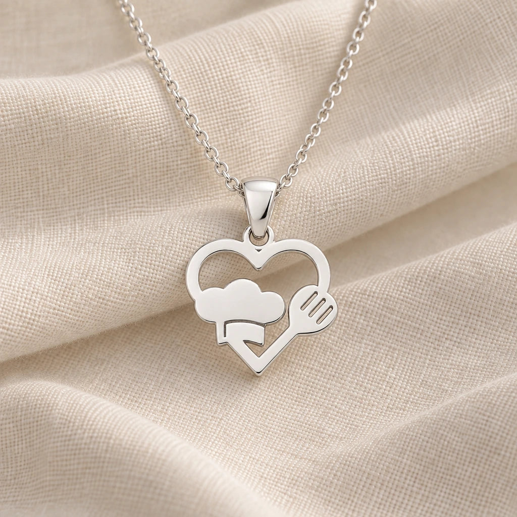 925 sterling silver chef heart pendant necklace on cream fabric