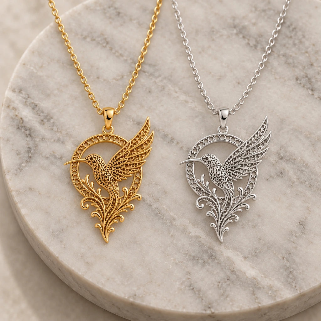 Fossil Hummingbird Halo pendant necklace in silver and gold finishes side by side
