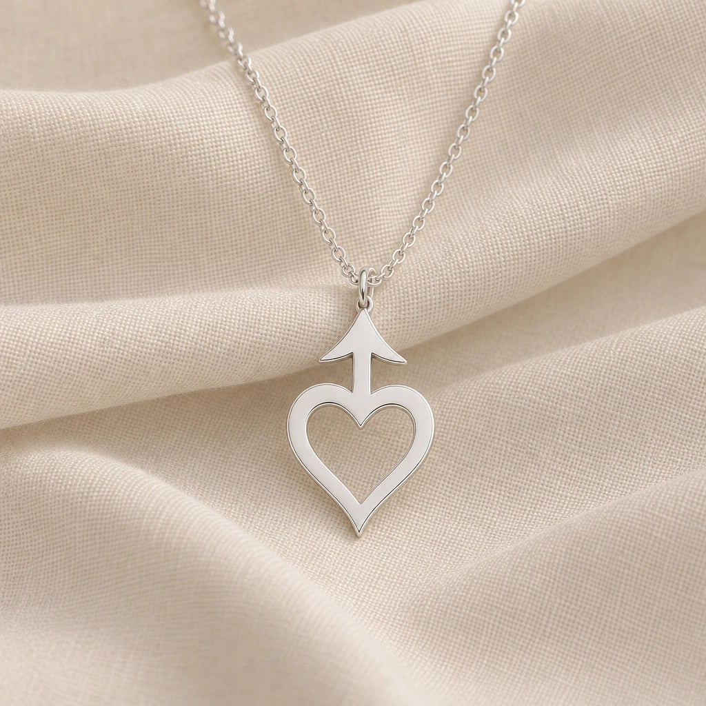 925 sterling silver amor asteroid symbol pendant necklace on cream fabric