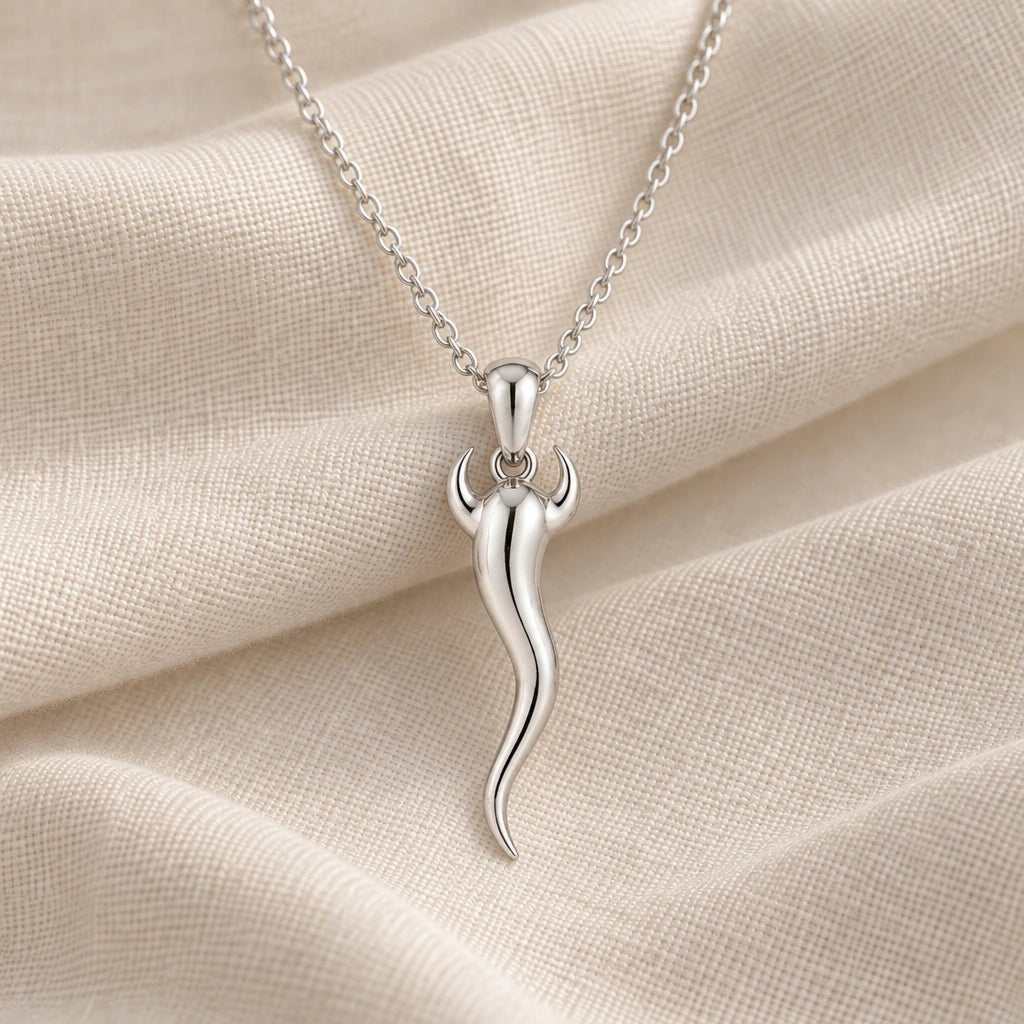 925 sterling silver italian horn cornicello pendant necklace on cream fabric
