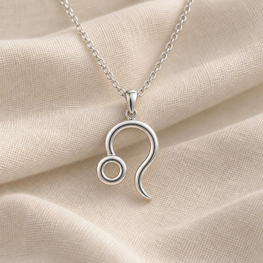 925 sterling silver leo zodiac glyph pendant necklace on cream fabric