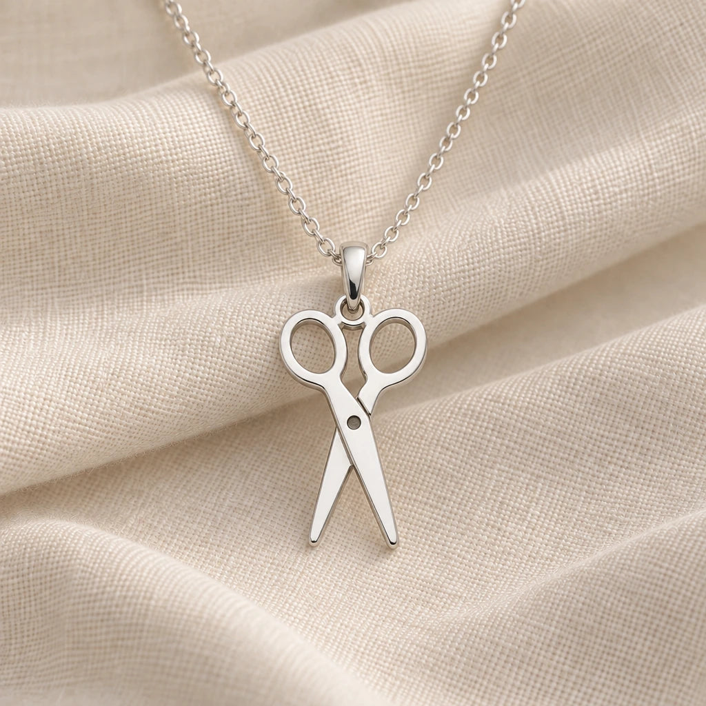 925 sterling silver scissors pendant necklace on cream fabric