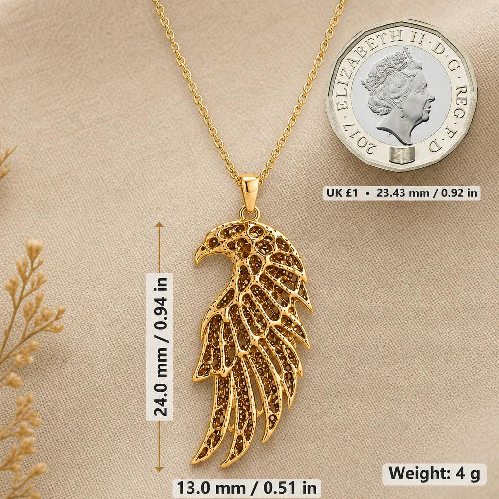 Falcon wing necklace size image showing 24 mm height, 13 mm width and 4 g weight beside a UK pound coin