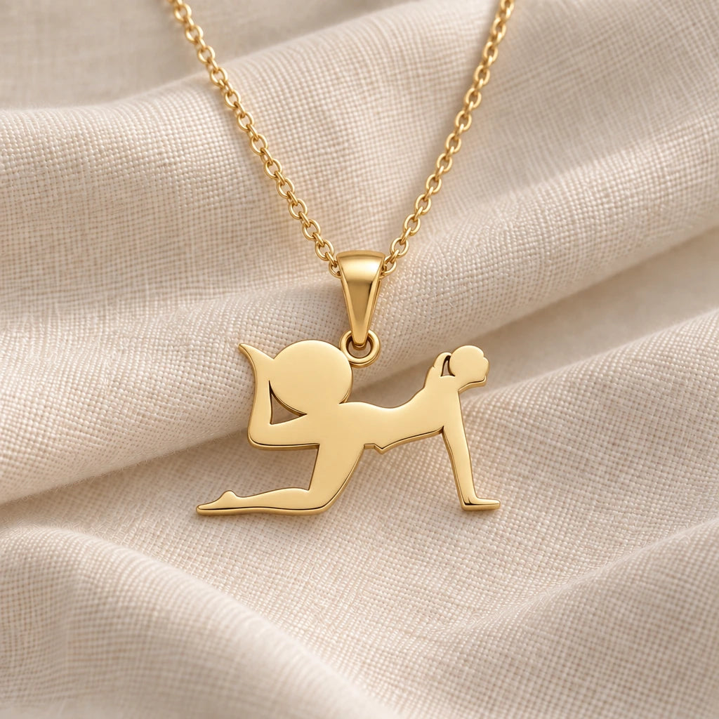 Yoga Pigeon Pose pendant necklace in an 18k gold plated finish