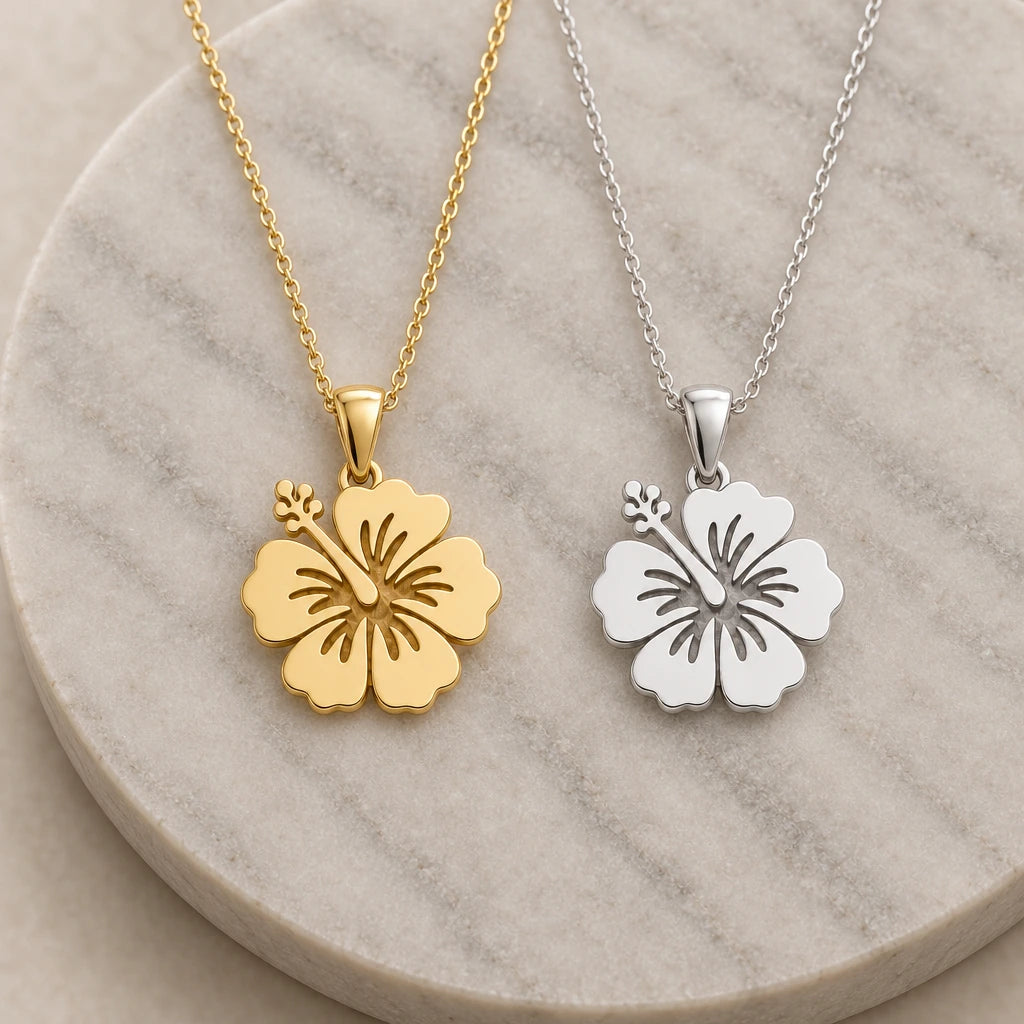 Hibiscus Bloom pendant necklace in silver and gold finishes side by side