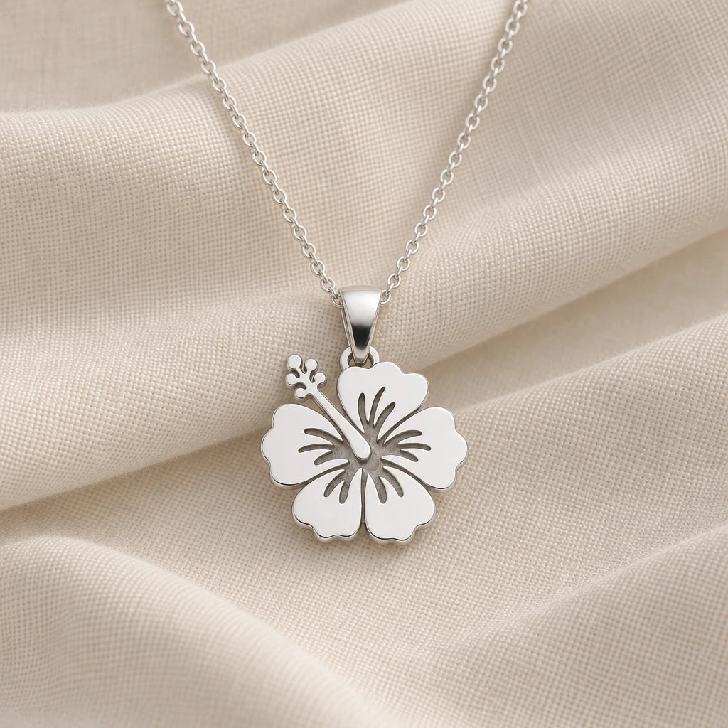925 sterling silver hibiscus bloom pendant necklace on cream fabric