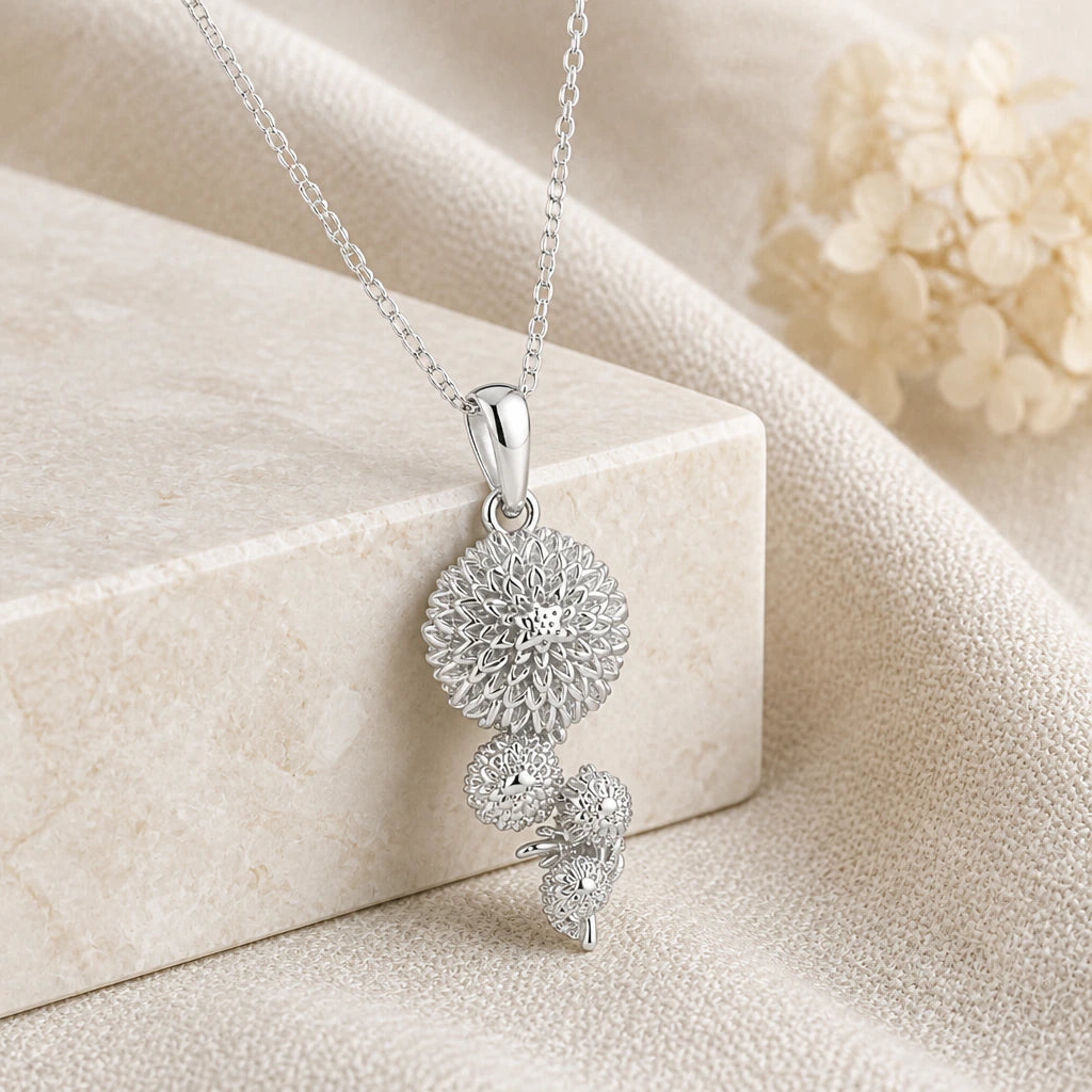 925 sterling silver chrysanthemum flower pendant necklace on softly folded cream linen