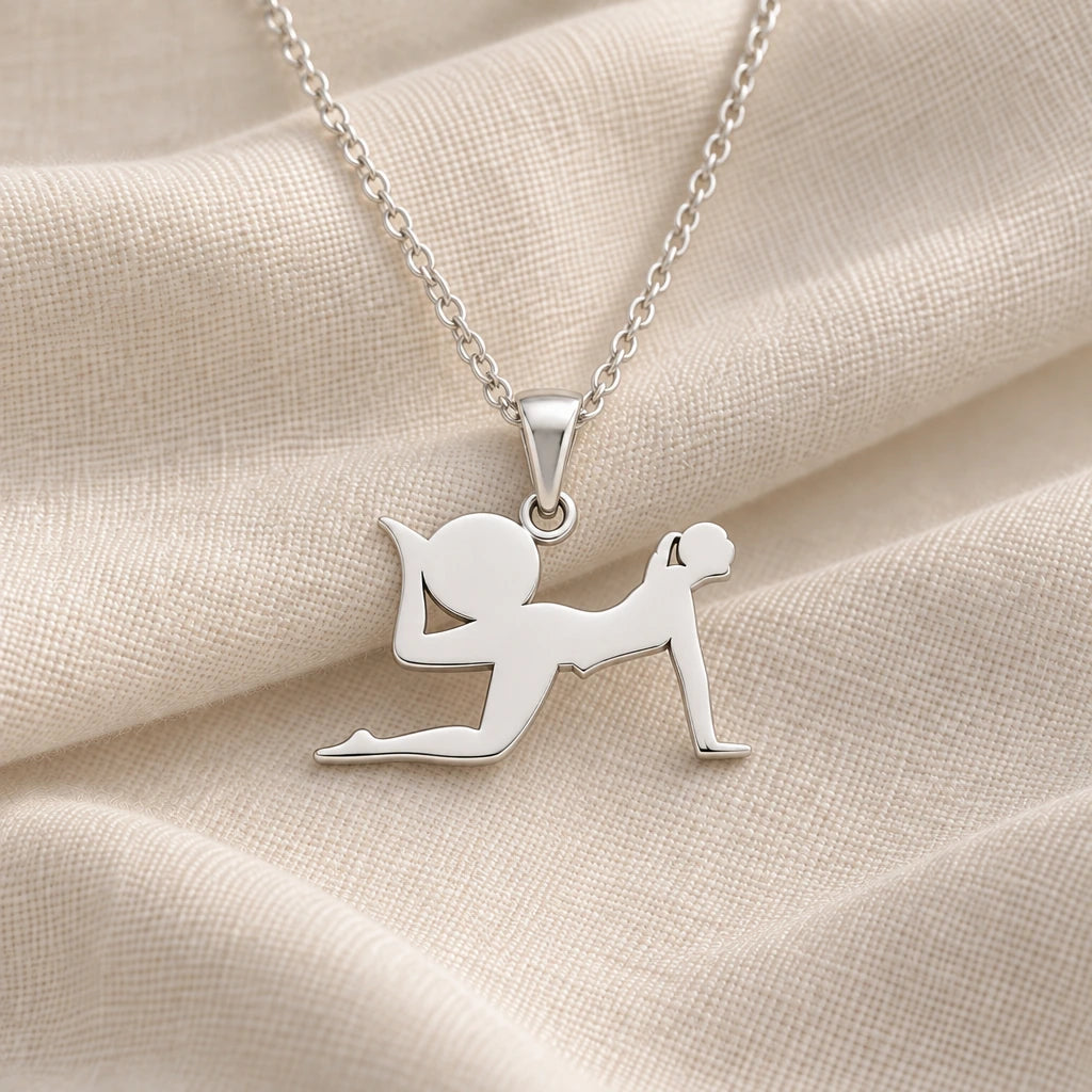 925 sterling silver yoga pigeon pose pendant necklace on cream fabric