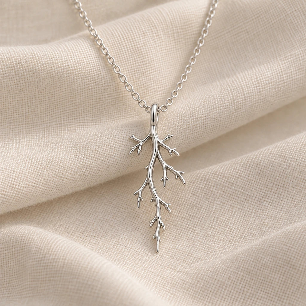 925 sterling silver mystic forest branch pendant necklace on cream fabric