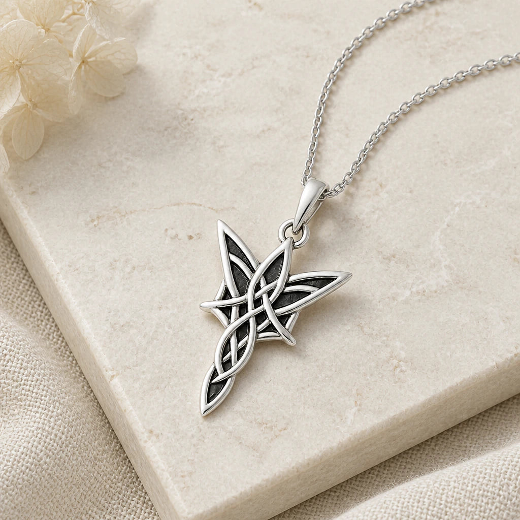Close-up of silver elven star pendant showing the sculpted detail