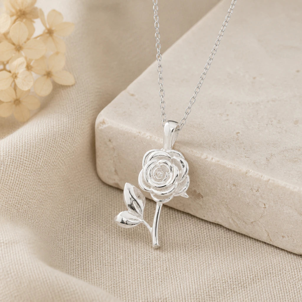 925 sterling silver rose birth flower pendant necklace on softly folded cream linen