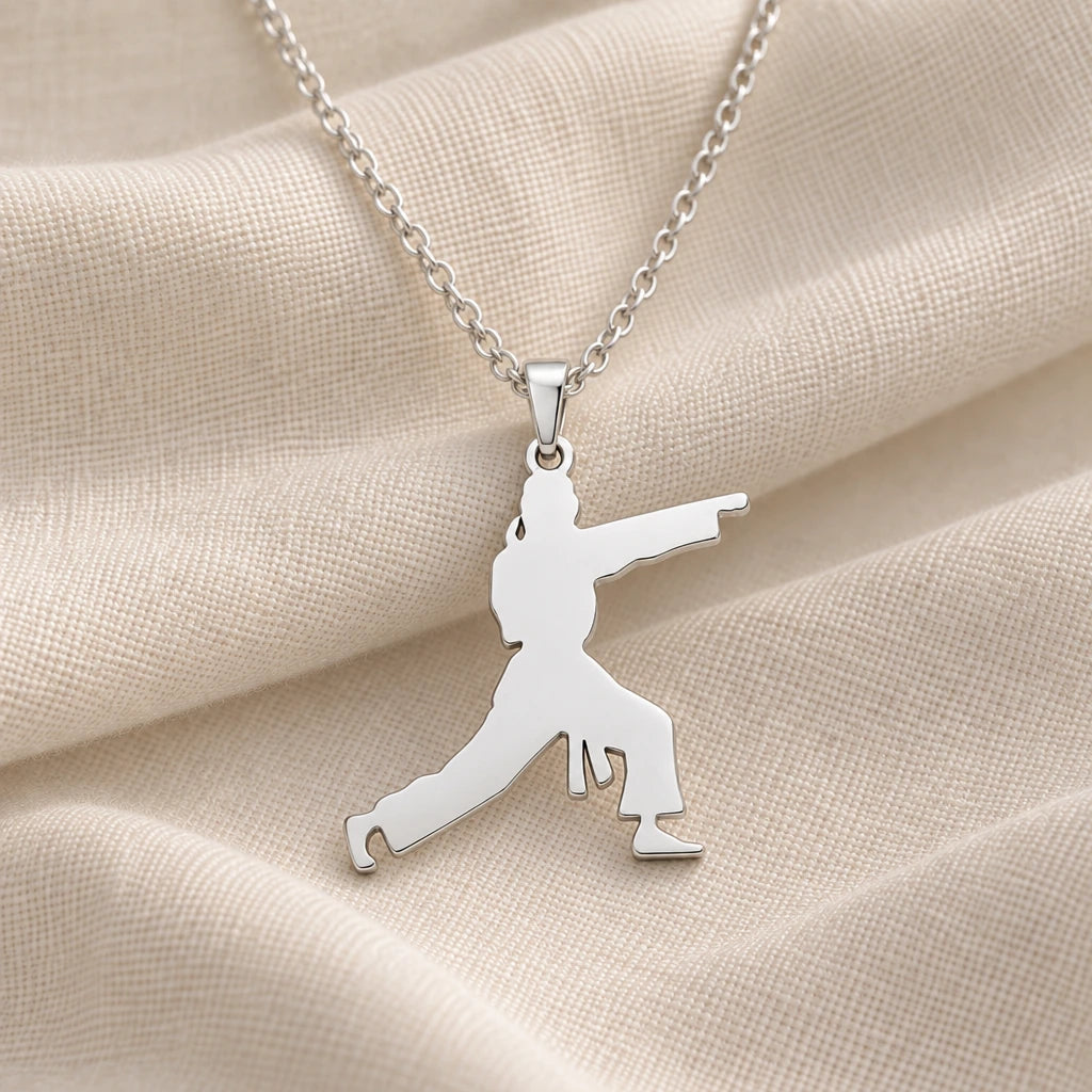 925 sterling silver karate fighter pendant necklace on cream fabric