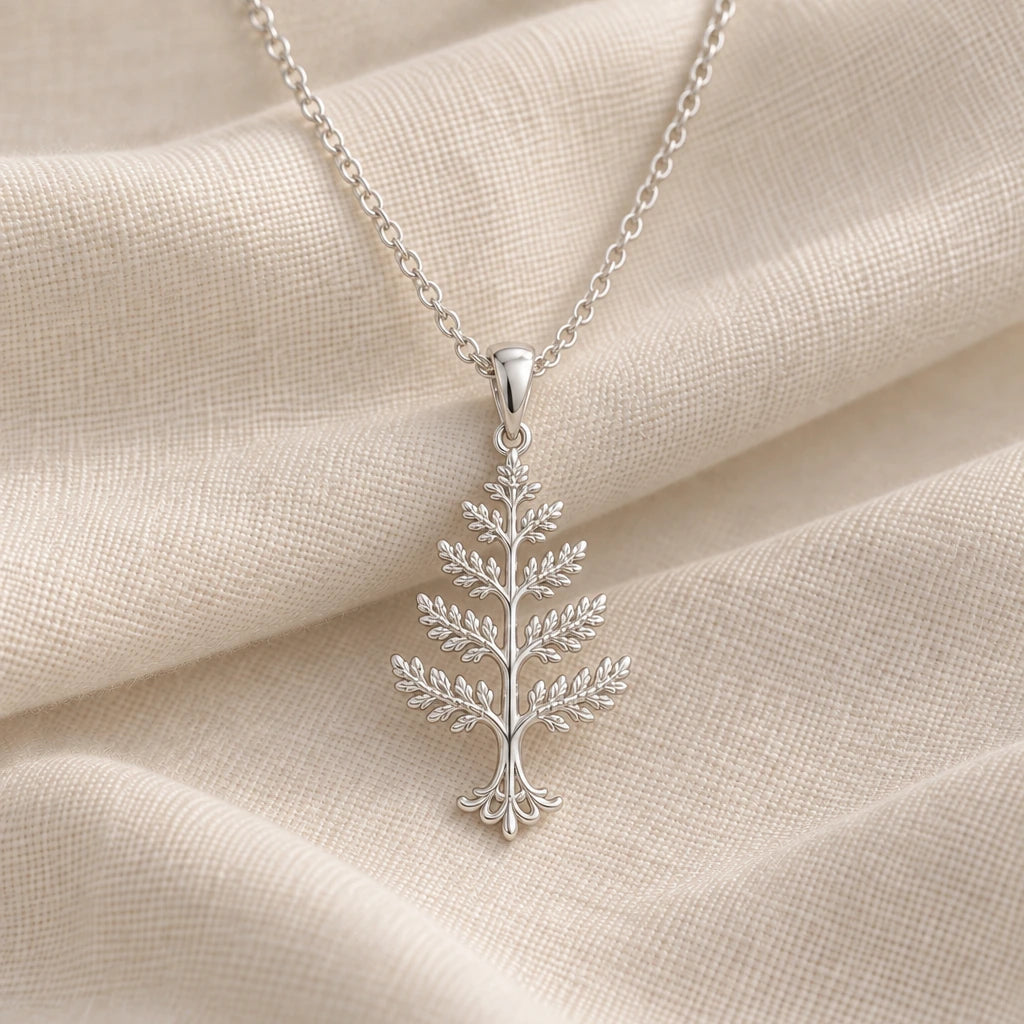 925 sterling silver cedar crest tree pendant necklace on cream fabric