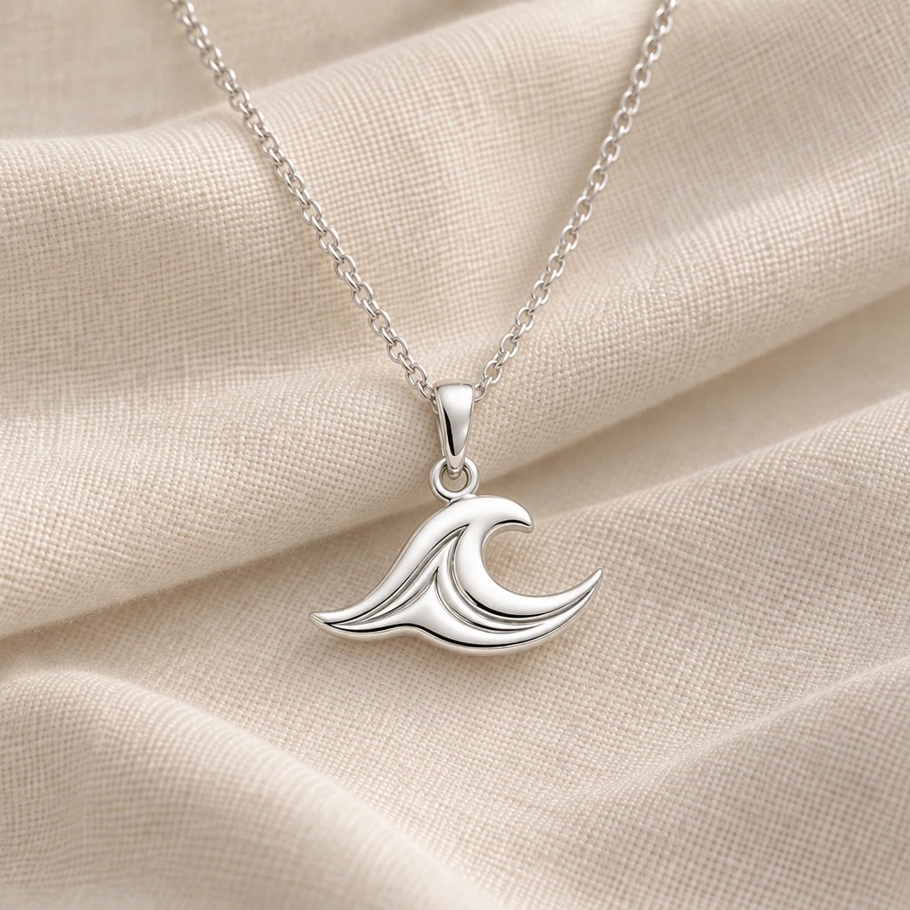 925 sterling silver sea wave pendant necklace on cream fabric