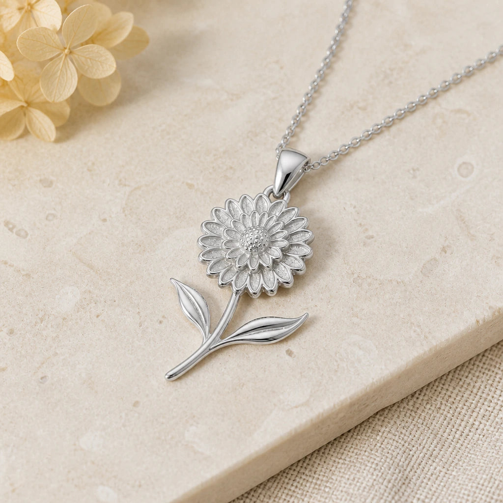Close-up of silver marigold bloom flower pendant showing the sculpted detail