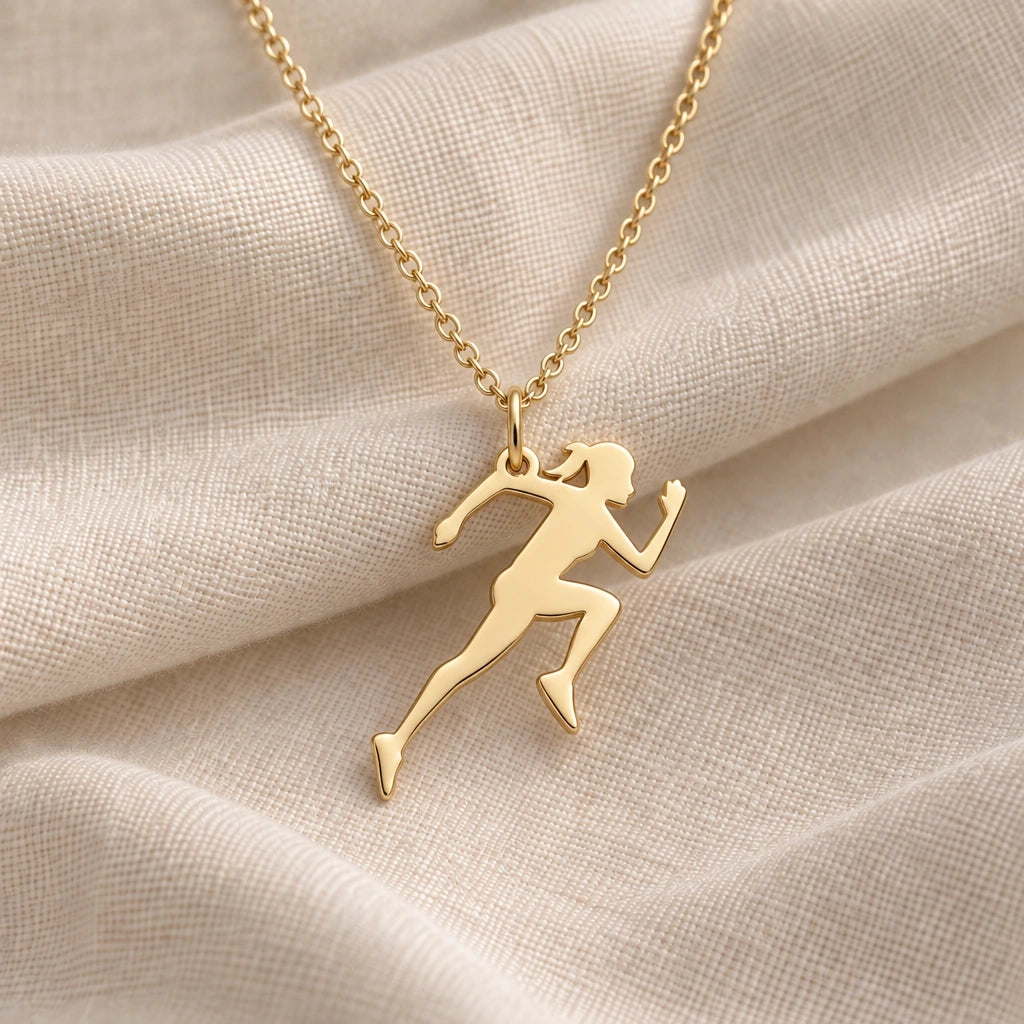 Running Woman pendant necklace in an 18k gold plated finish