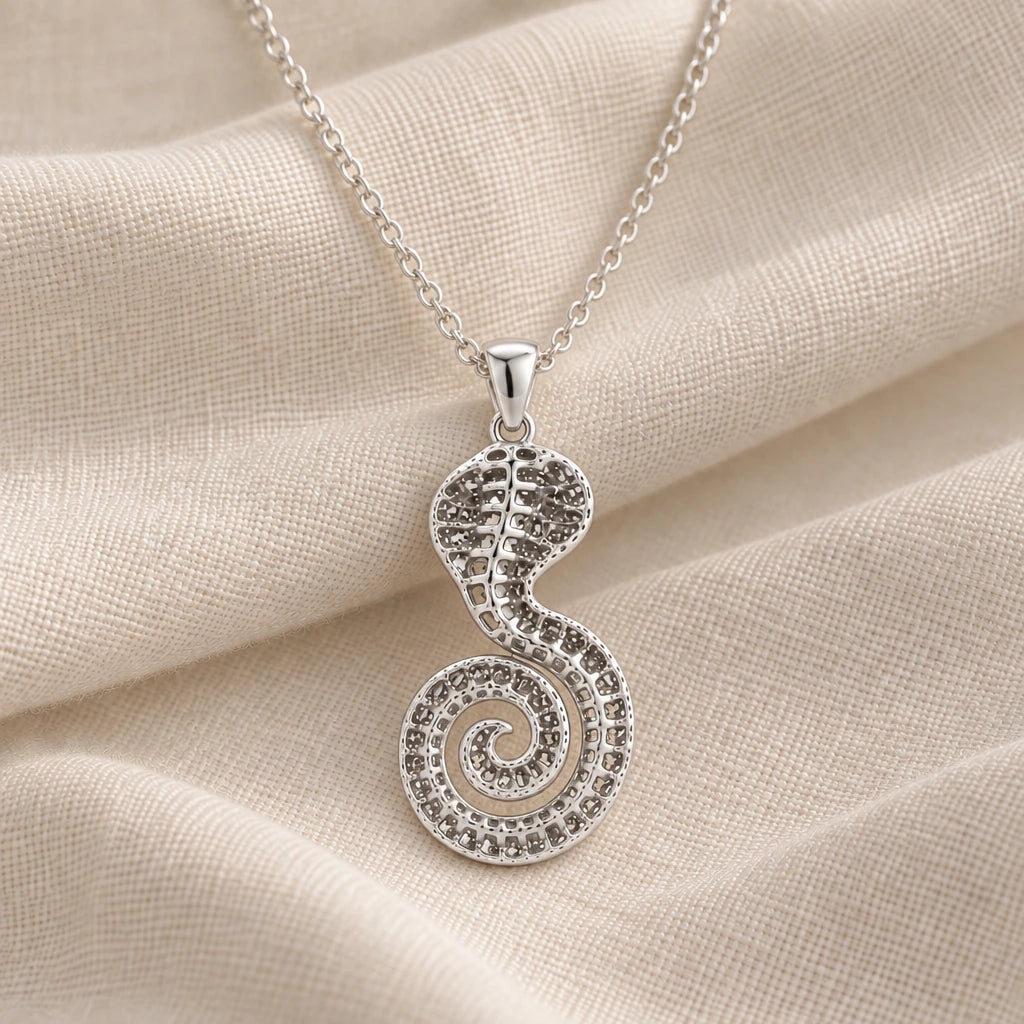 925 sterling silver sacred cobra fossil pendant necklace on cream fabric