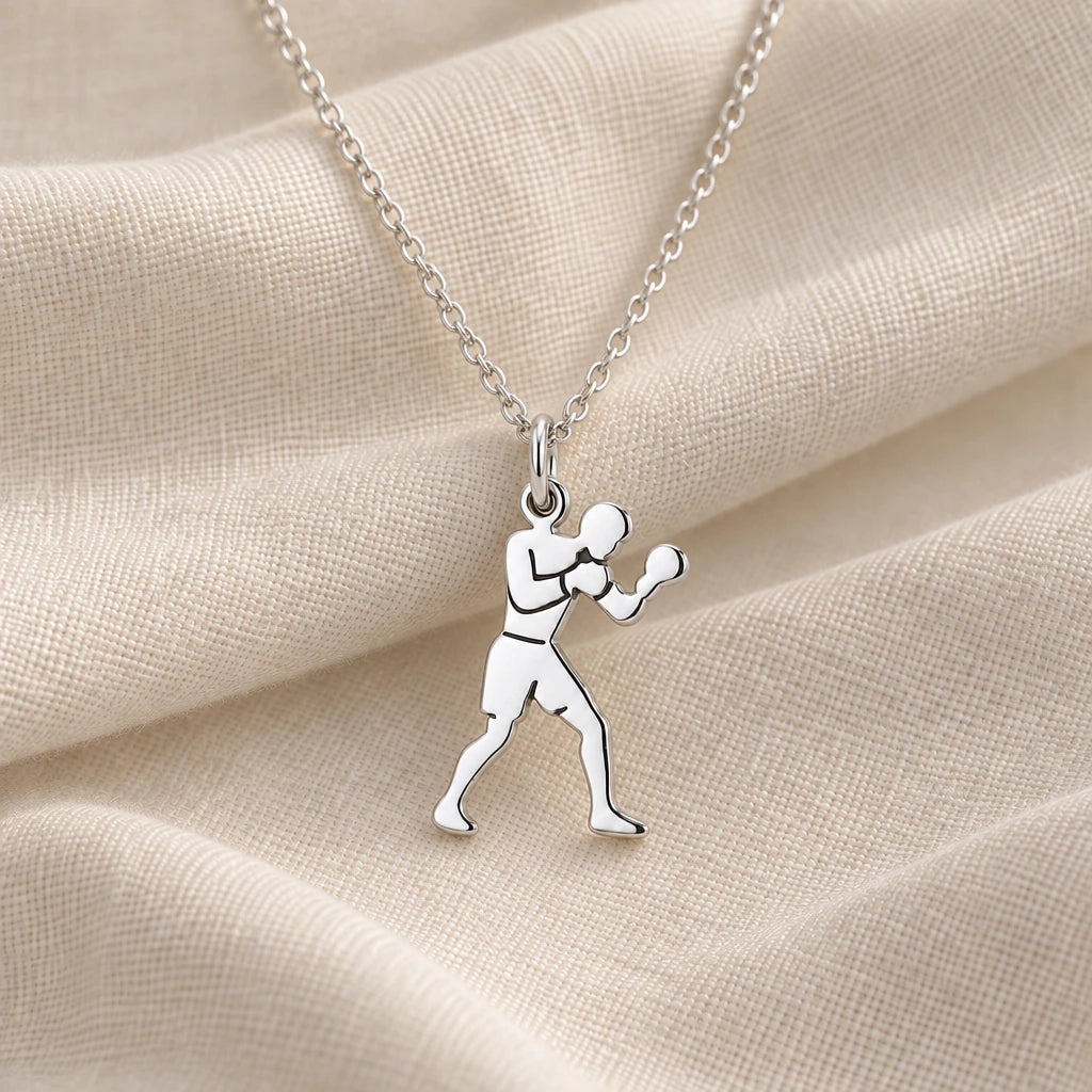 925 sterling silver male boxer pendant necklace on cream fabric