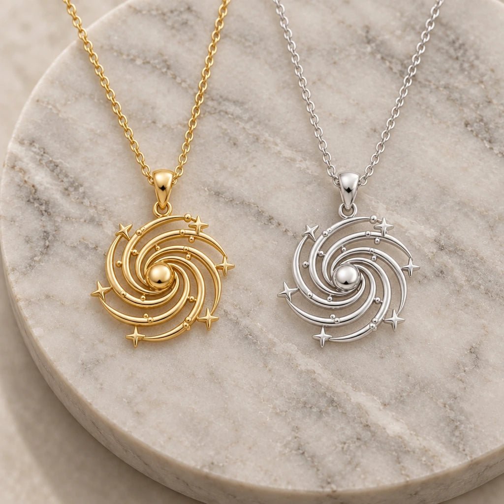 Spiral Galaxy pendant necklace in silver and gold finishes side by side