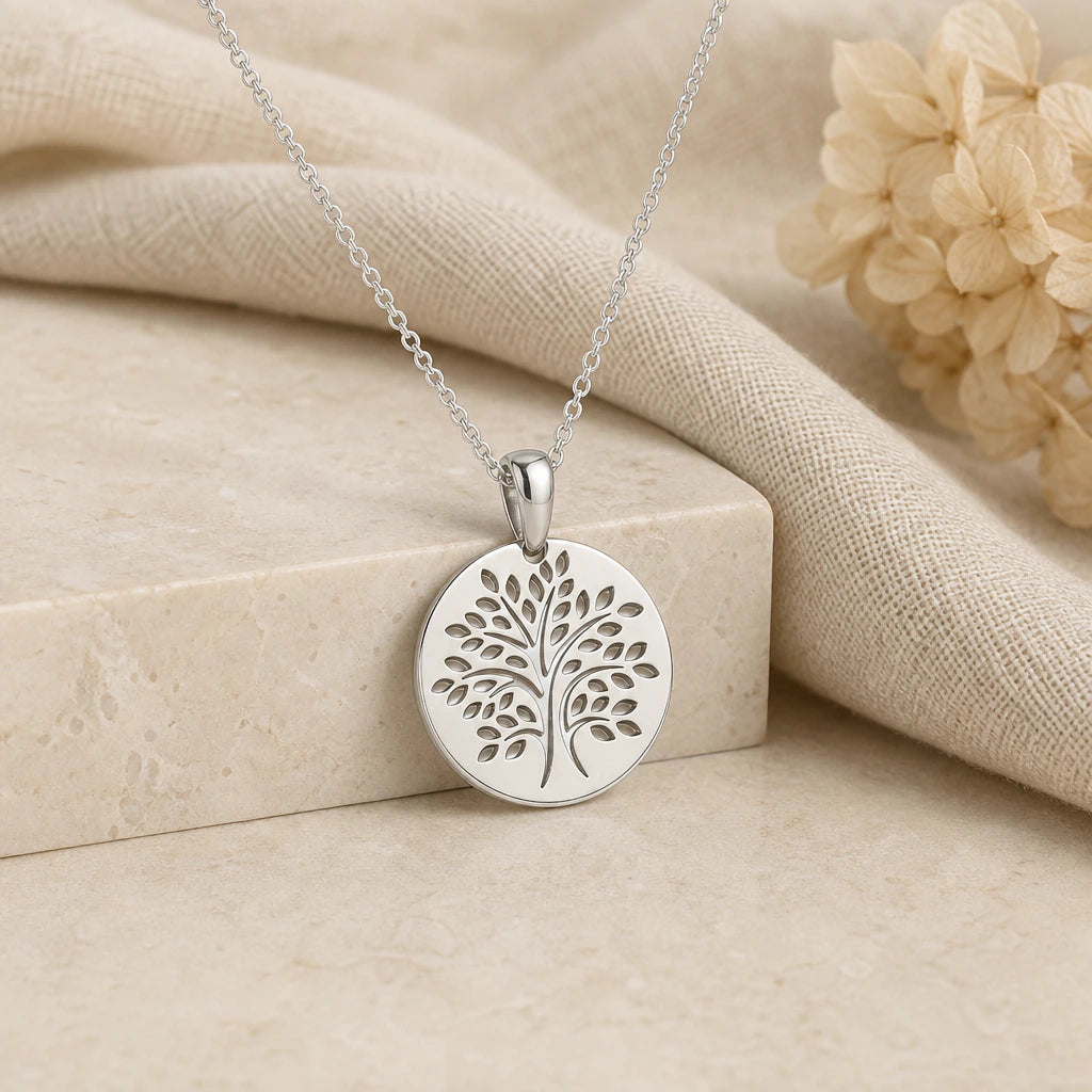 925 sterling silver tree of life disc pendant necklace on softly folded cream linen
