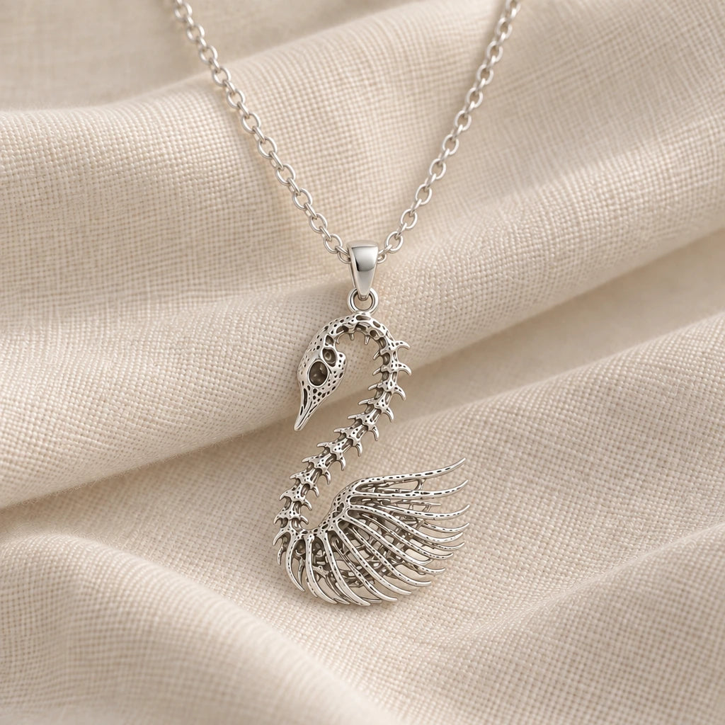 925 sterling silver fossil swan skeleton pendant necklace on cream fabric