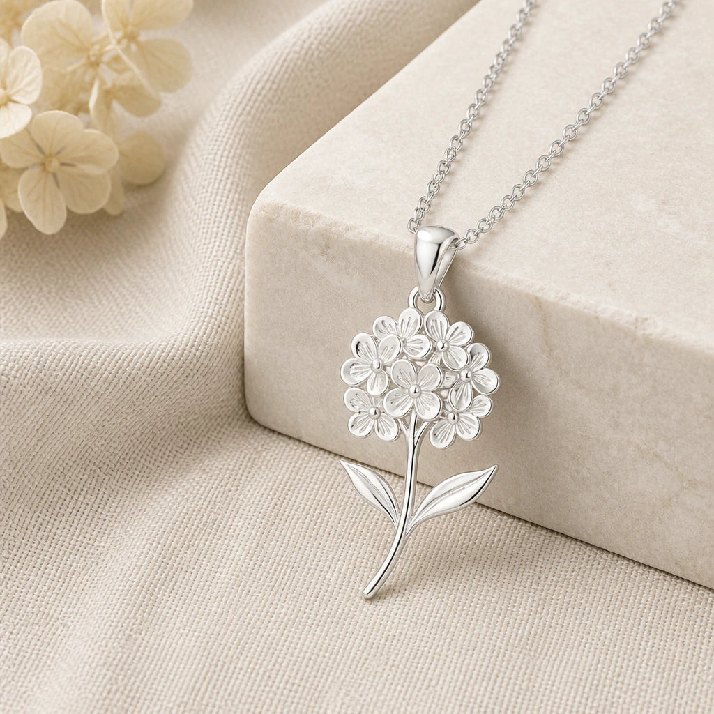 925 sterling silver hydrangea flower pendant necklace on softly folded cream linen