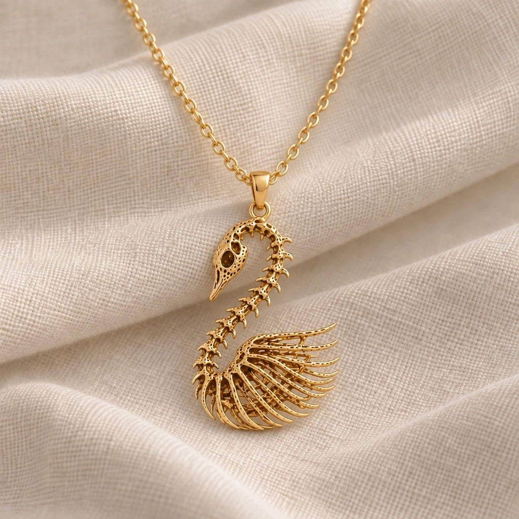 Fossil Swan Skeleton pendant necklace in an 18k gold plated finish