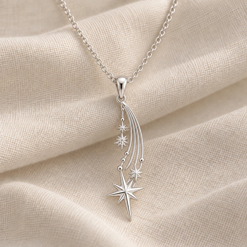 925 sterling silver falling star comet pendant necklace on cream fabric