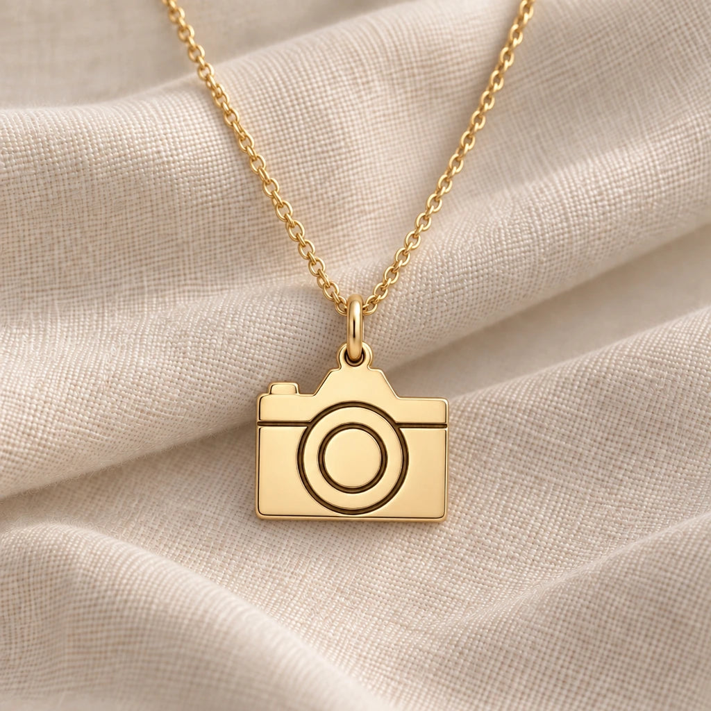 Camera pendant necklace in an 18k gold plated finish