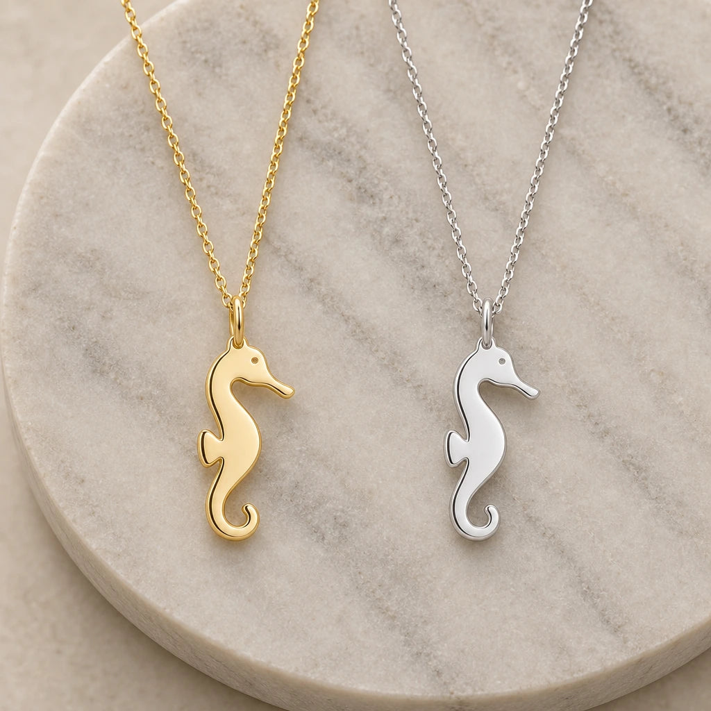 Seahorse Silhouette pendant necklace in silver and gold finishes side by side