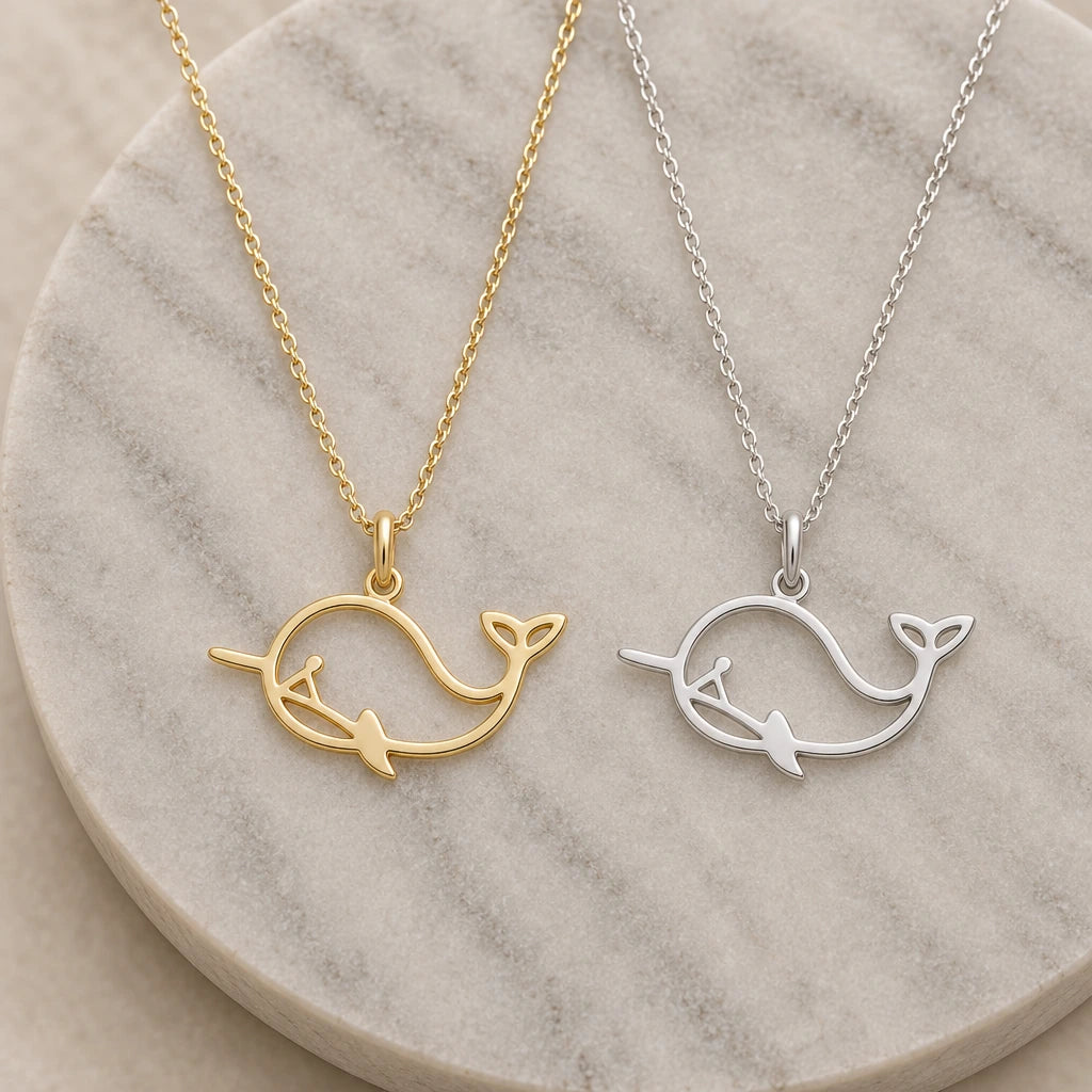 Whale Outline pendant necklace in silver and gold finishes side by side