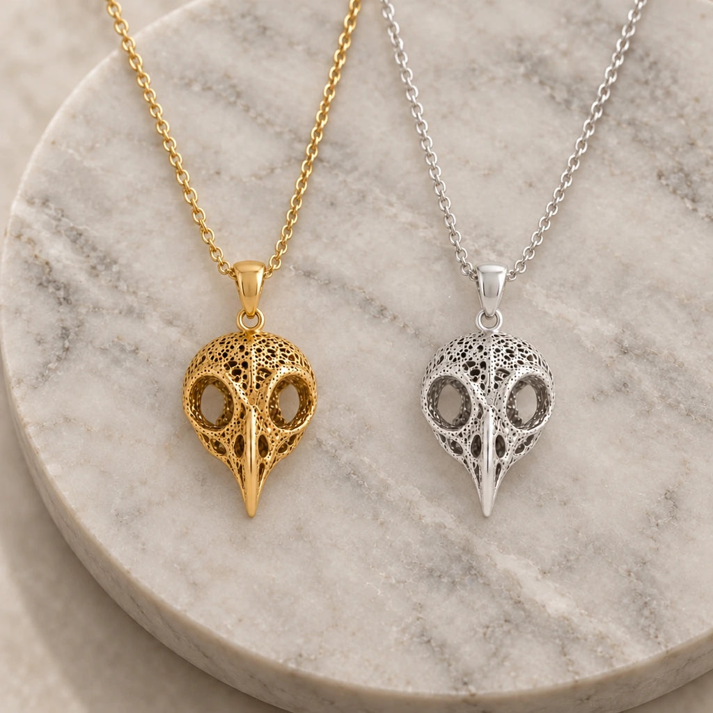 Ancient Owl Skull pendant necklace in silver and gold finishes side by side
