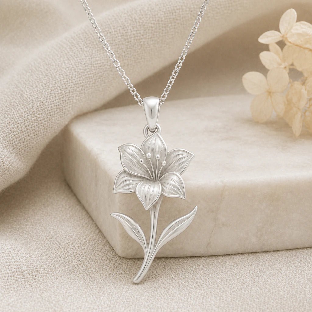 925 sterling silver amaryllis flower pendant necklace on softly folded cream linen