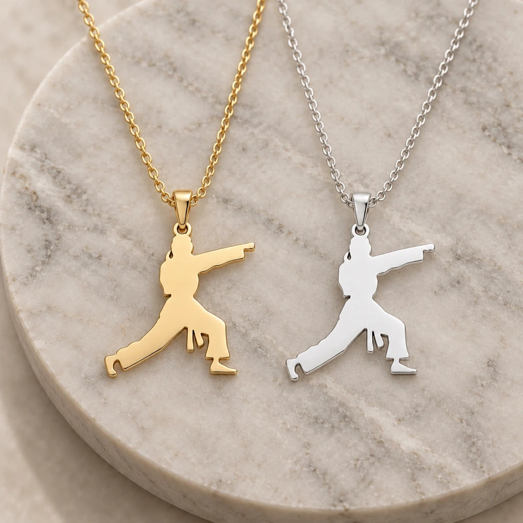 Karate Fighter pendant necklace in silver and gold finishes side by side