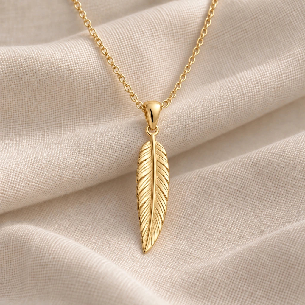 Engraved Feather pendant necklace in an 18k gold plated finish