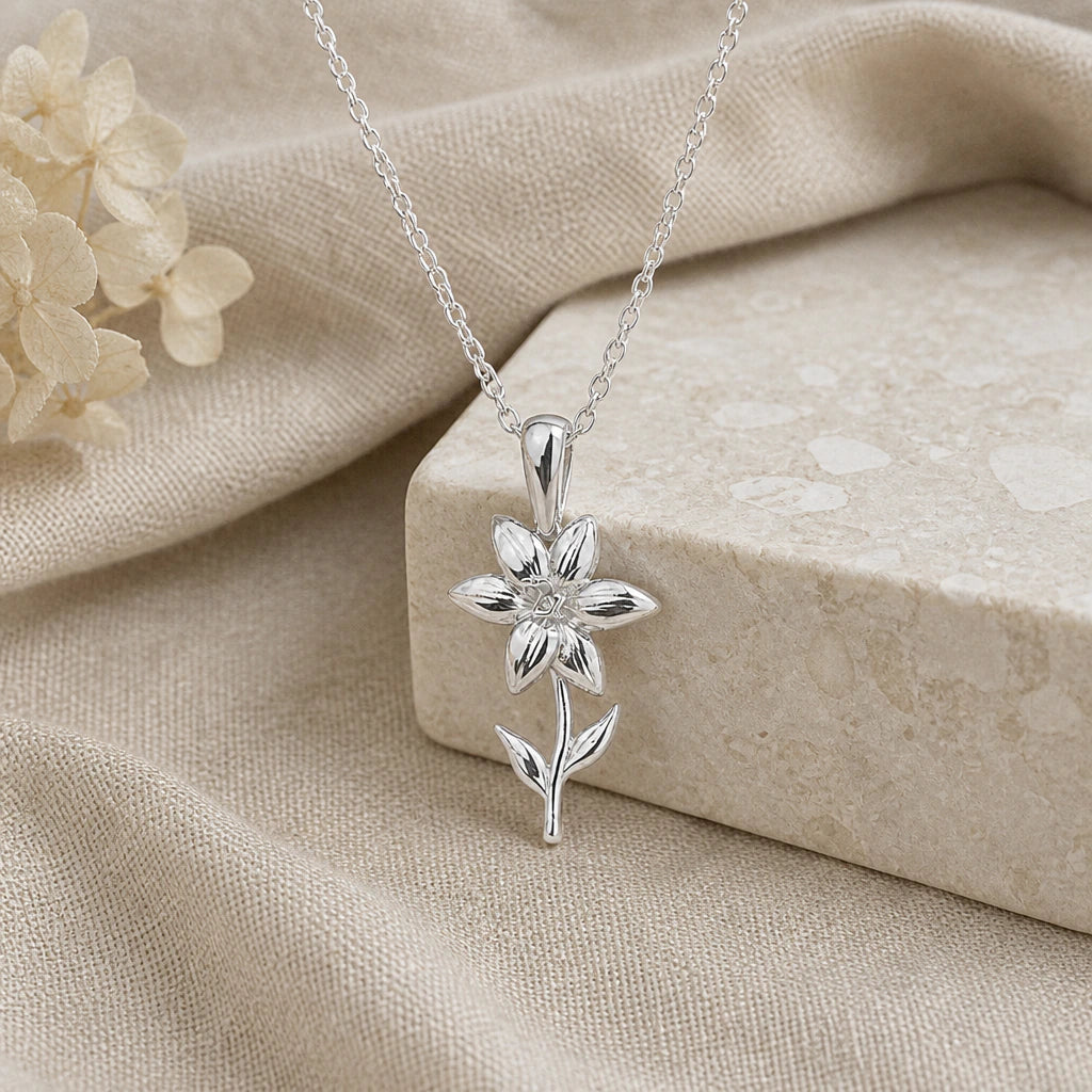 925 sterling silver single lily flower pendant necklace on softly folded cream linen