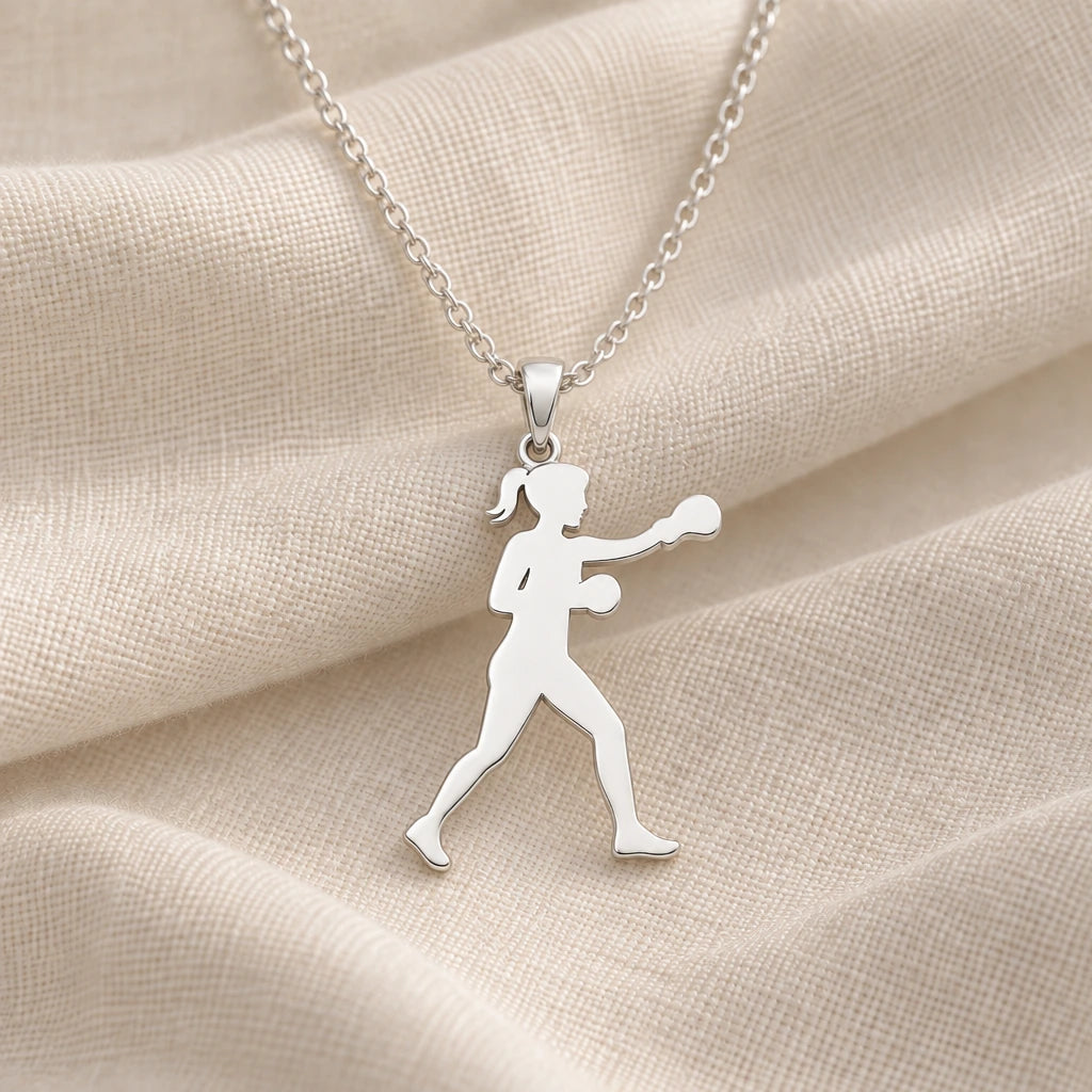 925 sterling silver female boxer punch pendant necklace on cream fabric