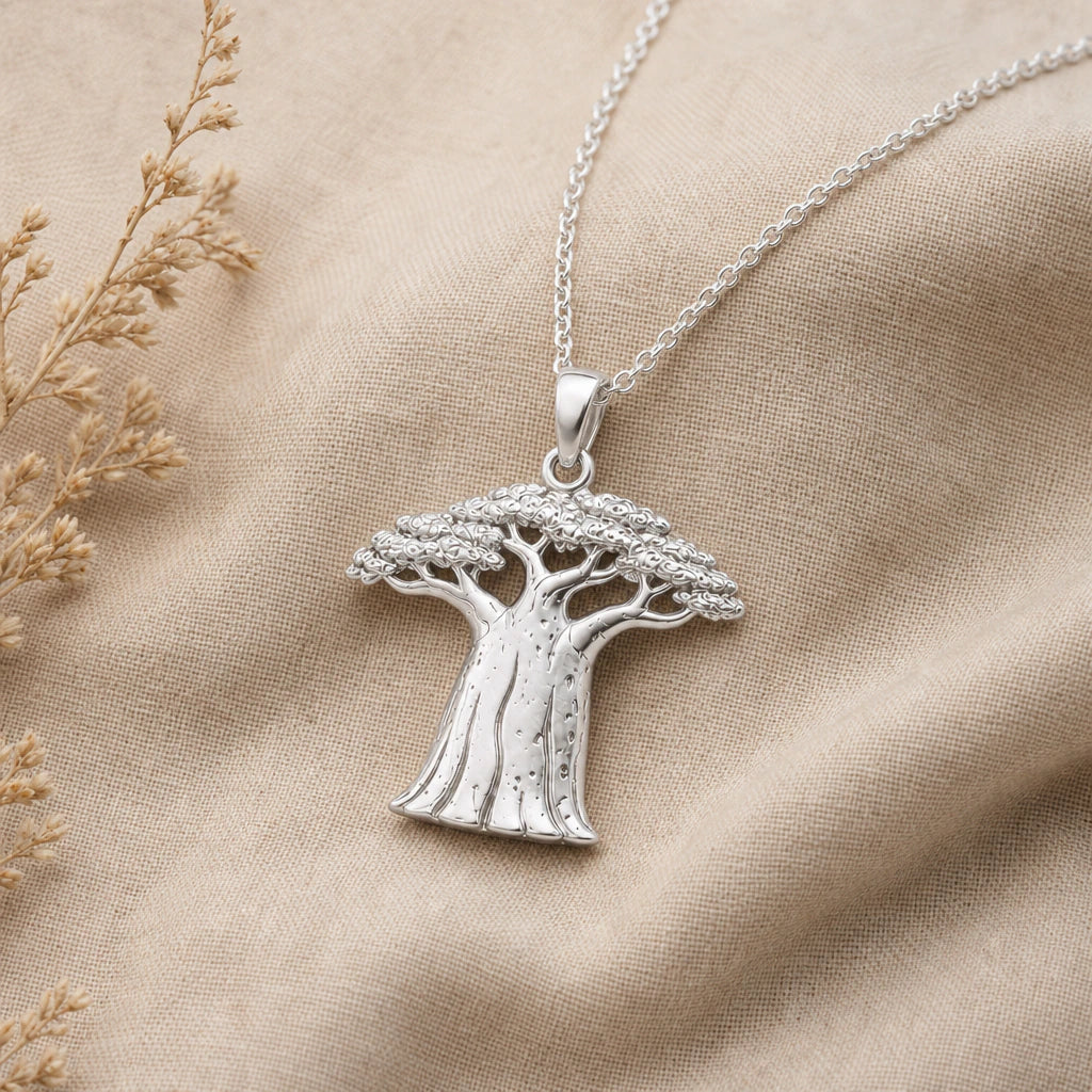 Close-up of silver baobab tree pendant with textured trunk and canopy