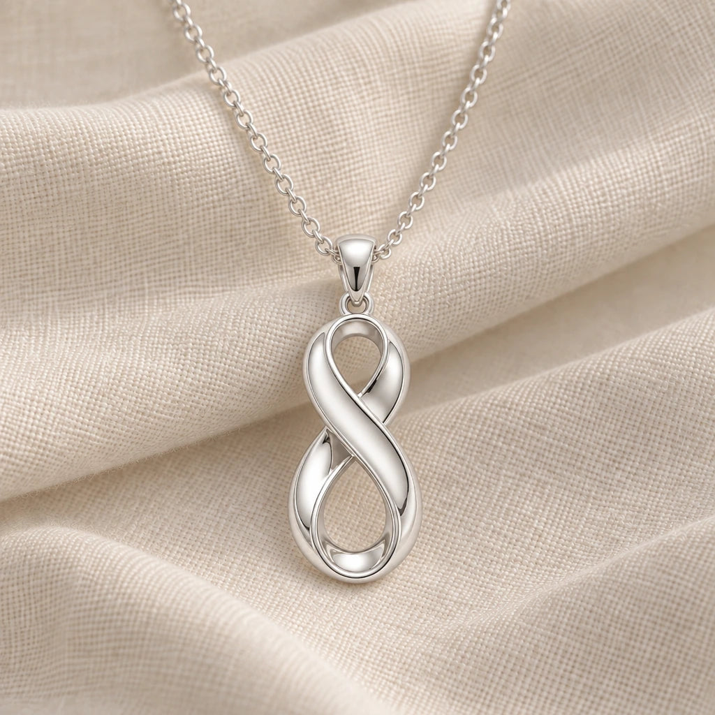 925 sterling silver infinity fold pendant necklace on cream fabric