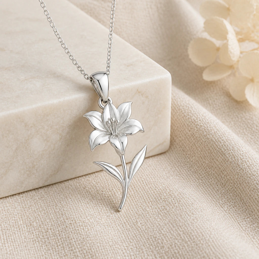 925 sterling silver amaryllis bloom flower pendant necklace on softly folded cream linen