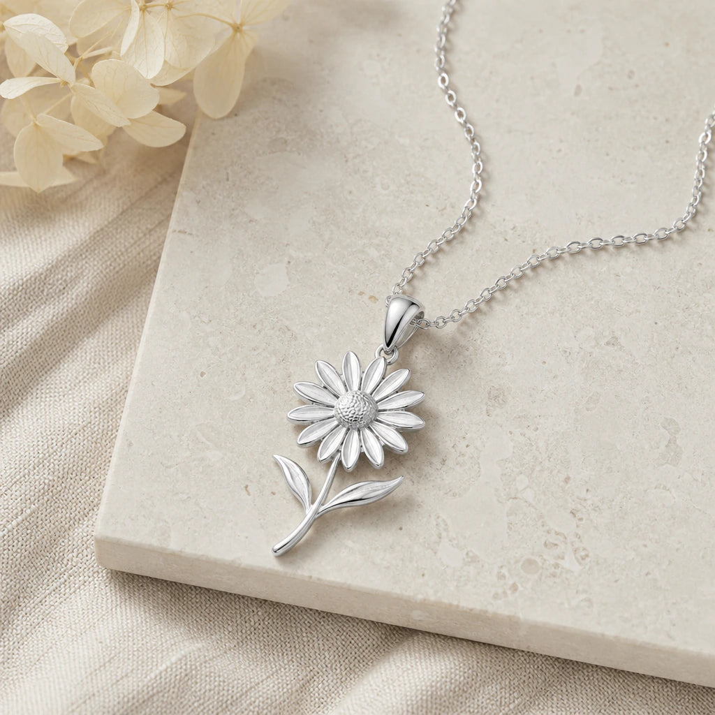 Close-up of silver black eyed susan flower pendant showing the sculpted detail