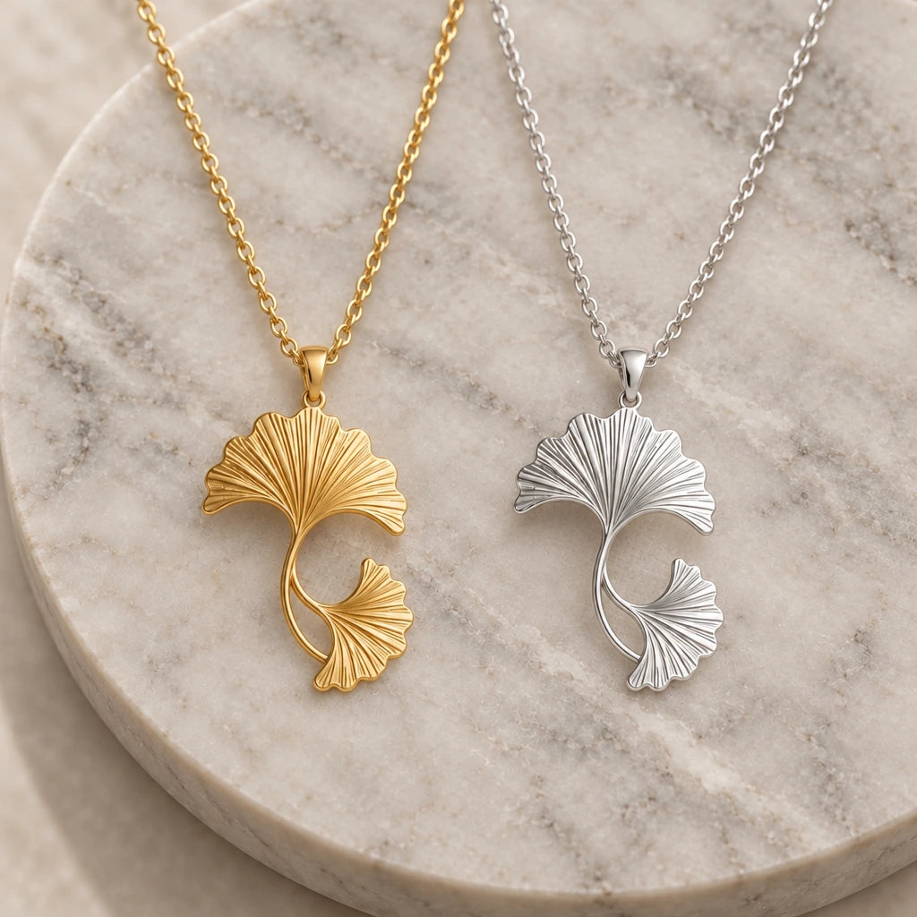 Ginkgo Fan Leaves pendant necklace in silver and gold finishes side by side