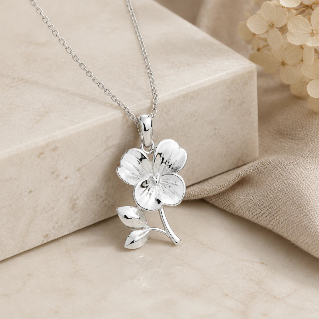 925 sterling silver violet birth flower pendant necklace on softly folded cream linen