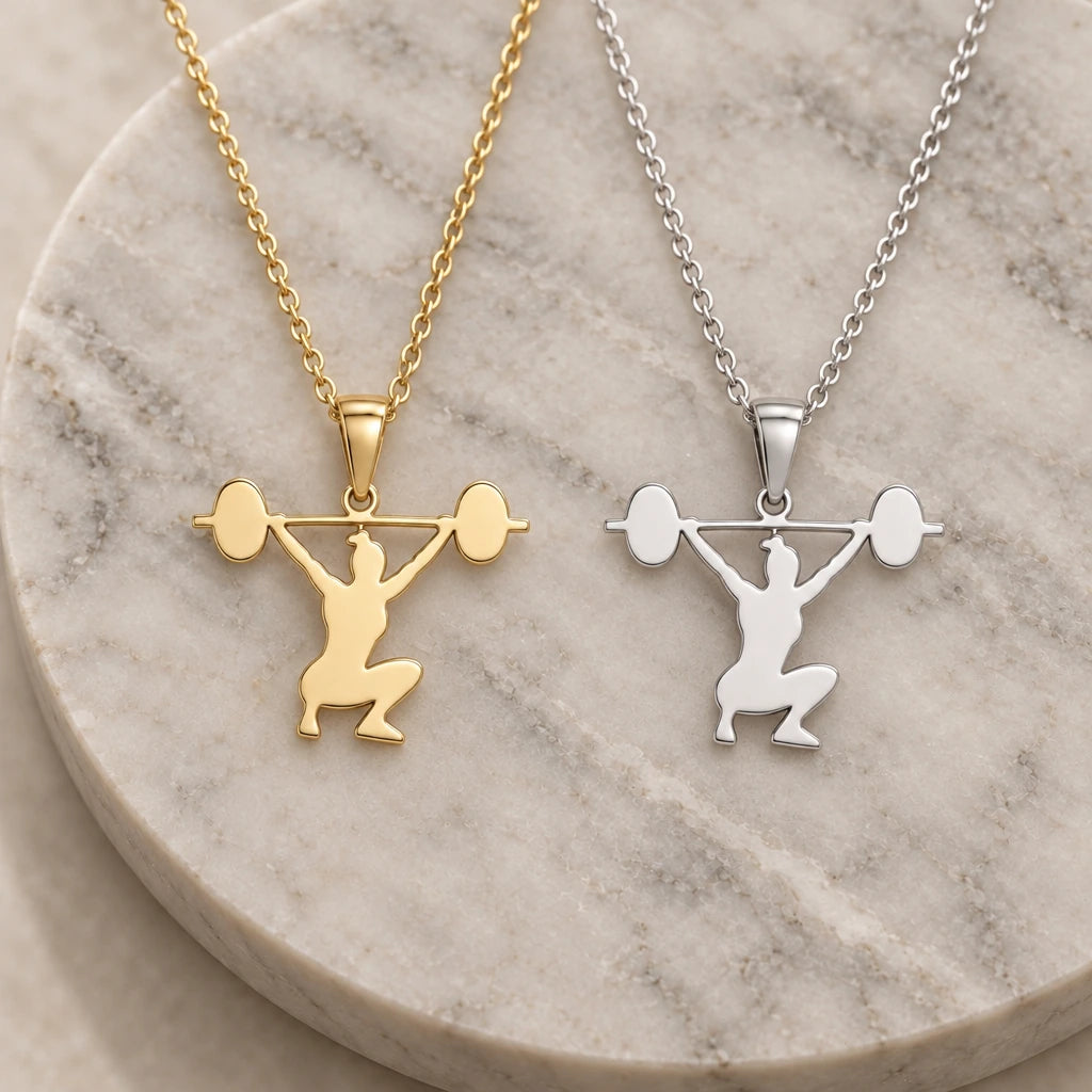 Weightlifter Snatch pendant necklace in silver and gold finishes side by side