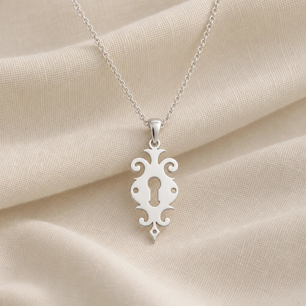 925 sterling silver ornate keyhole pendant necklace on cream fabric