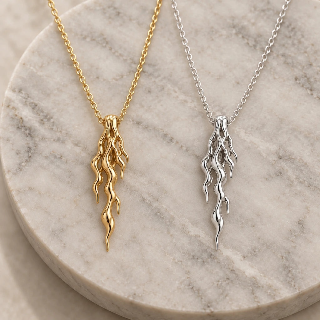 Molten Vein pendant necklace in silver and gold finishes side by side